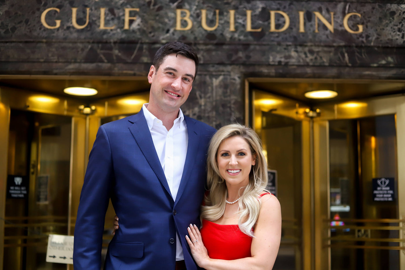 Henne Engagement Ring Couple Tom & Brittany Share a Smile In Front of Gulf Building