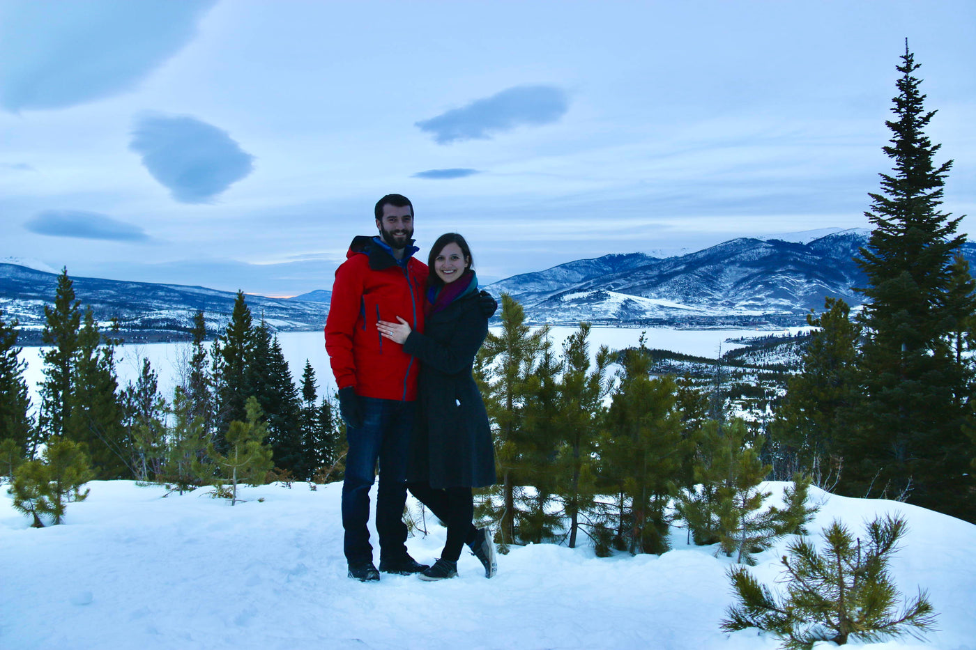 Henne Custom Engagement Ring Couple Sean & Gillian Smiling Outdoors in the Colorado Snow