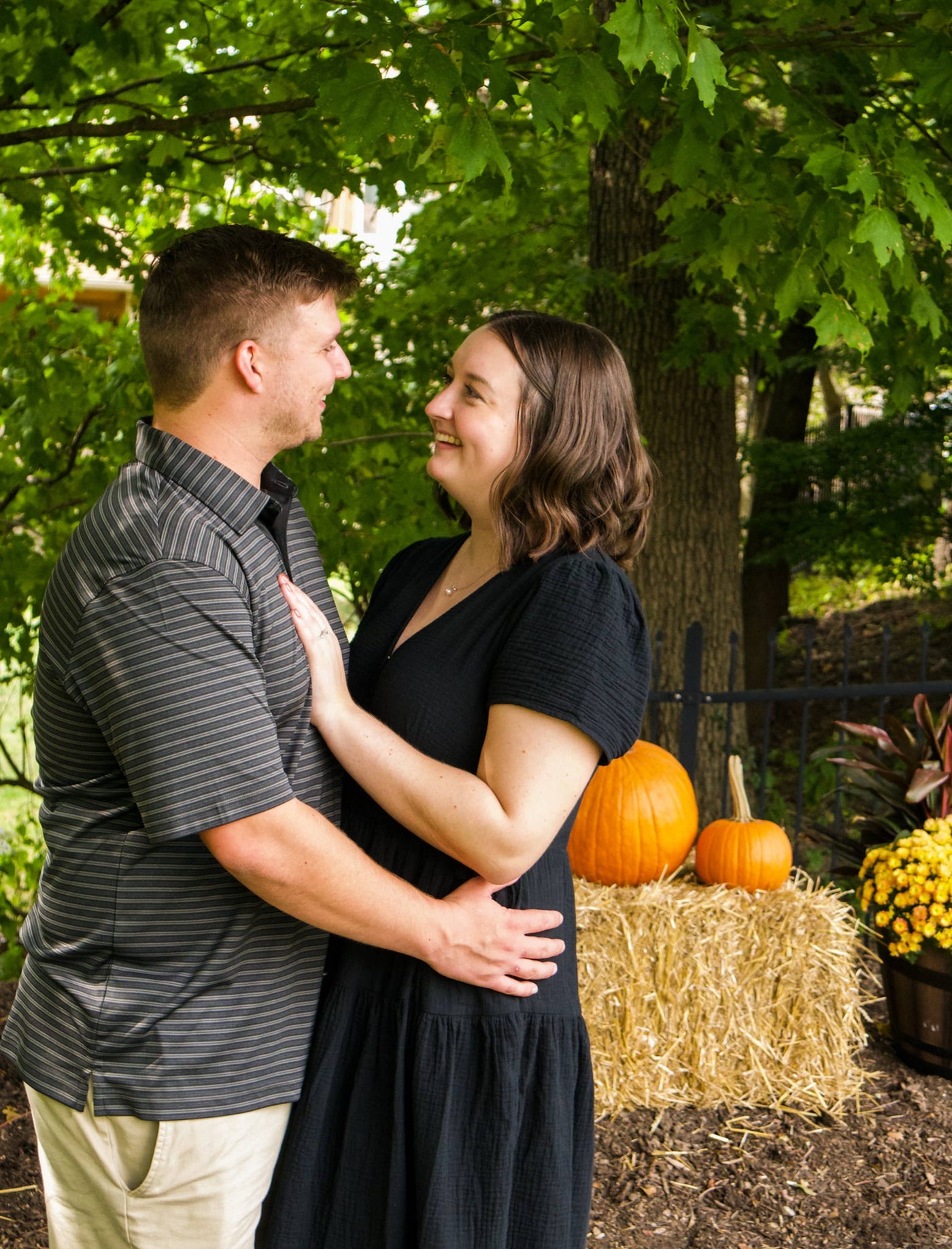 Henne Engagement Ring Couple Eric and Colleen Standing in a Pumpkin Patch