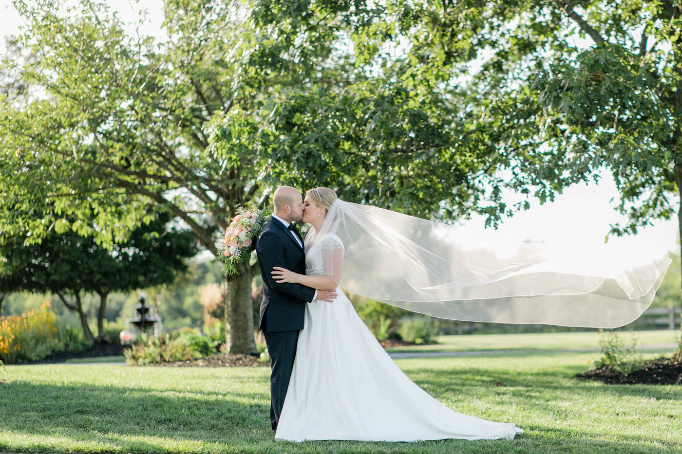 Henne Engagement Ring Couple Charlie & Skylar Share a Kiss on Their Wedding Day