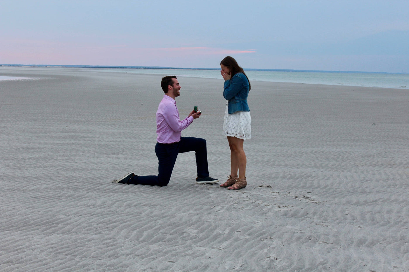 Luke Proposing to Taylor on the Beach with an Engagement Ring from Henne Jewelers