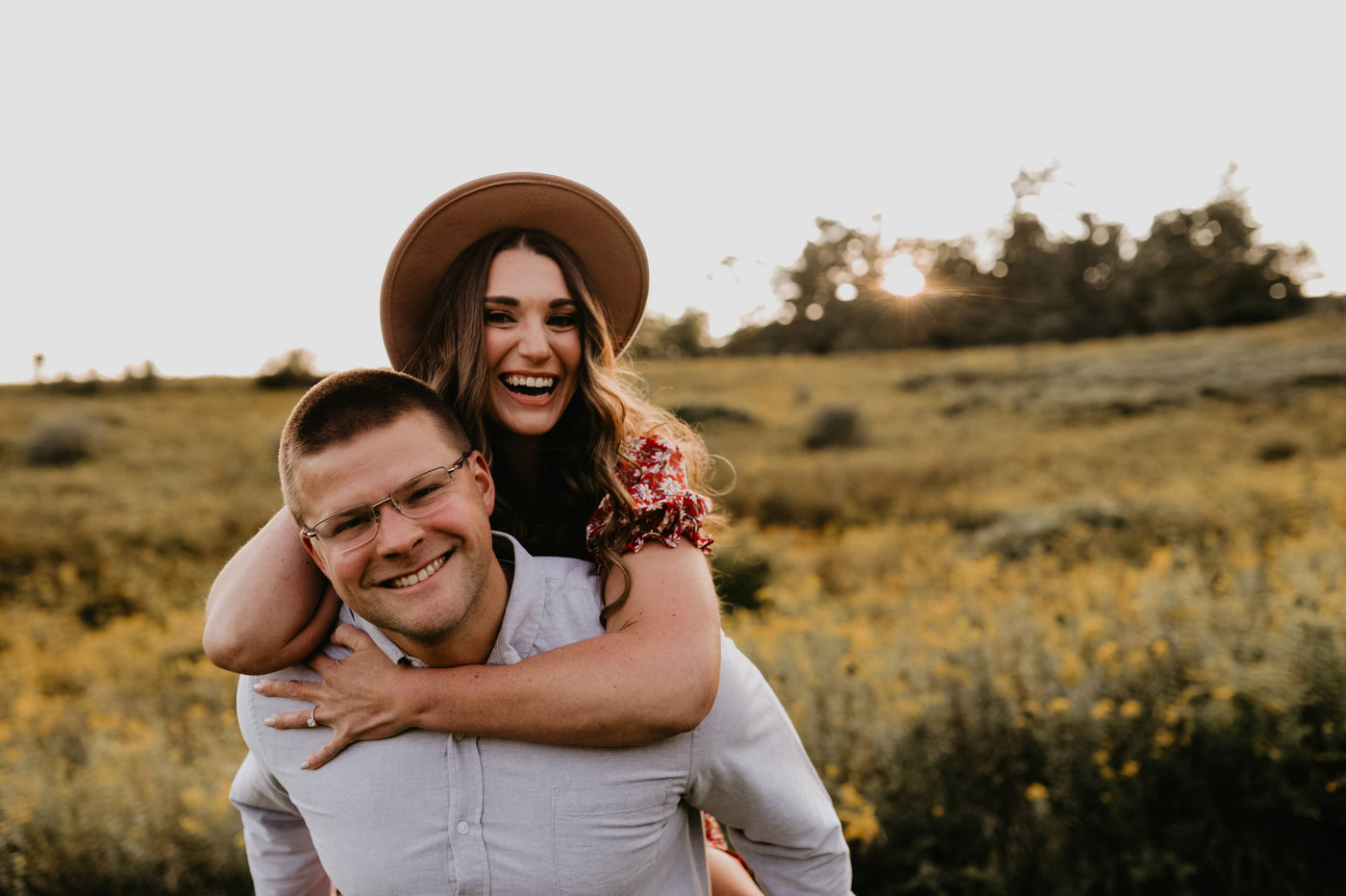 Henne Engagement Ring Couple Preston and Shannan Embrace at Sunset in the Woods