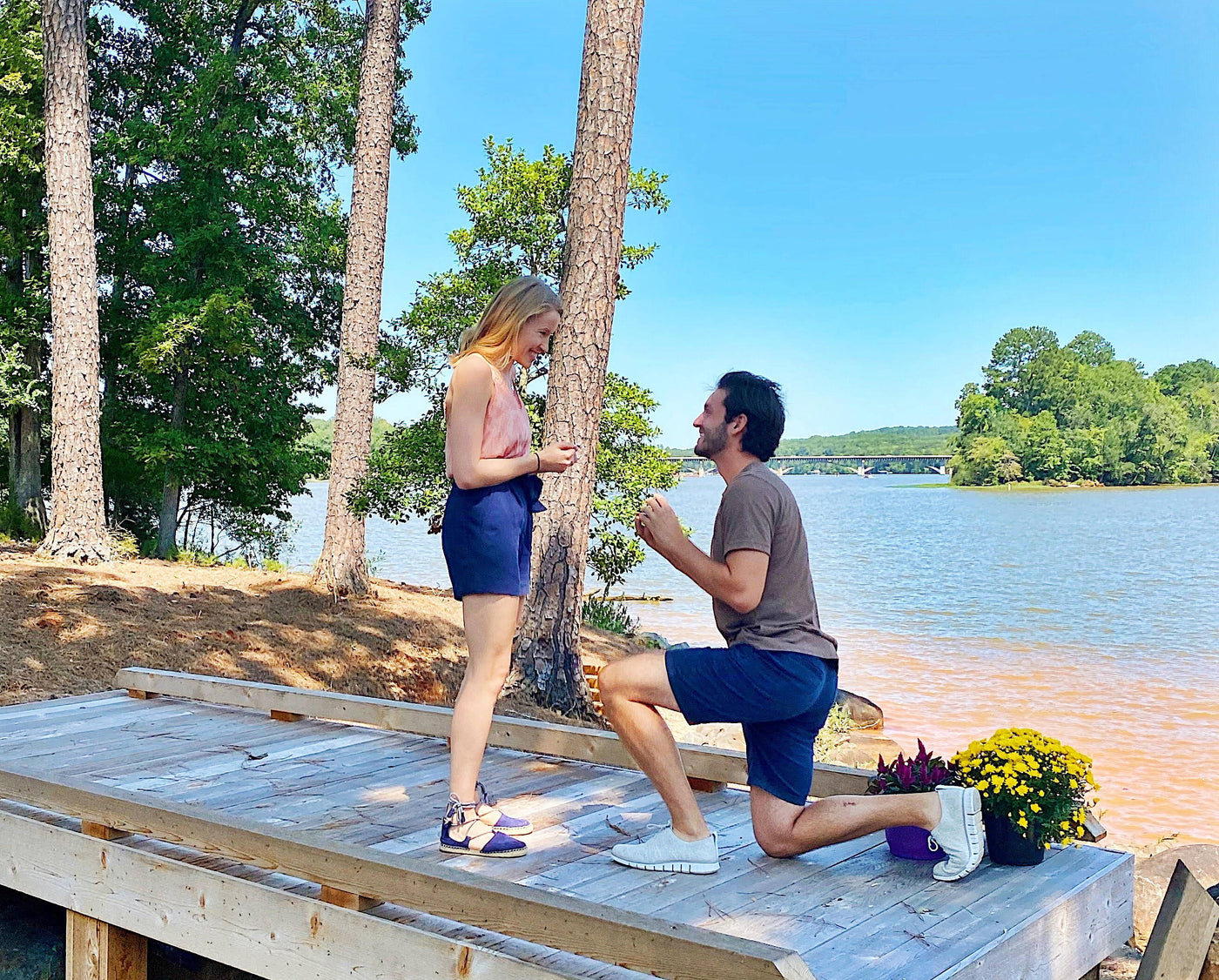 Anthony Proposes to Emily on a Dock with an Engagement Ring from Henne Jewelers