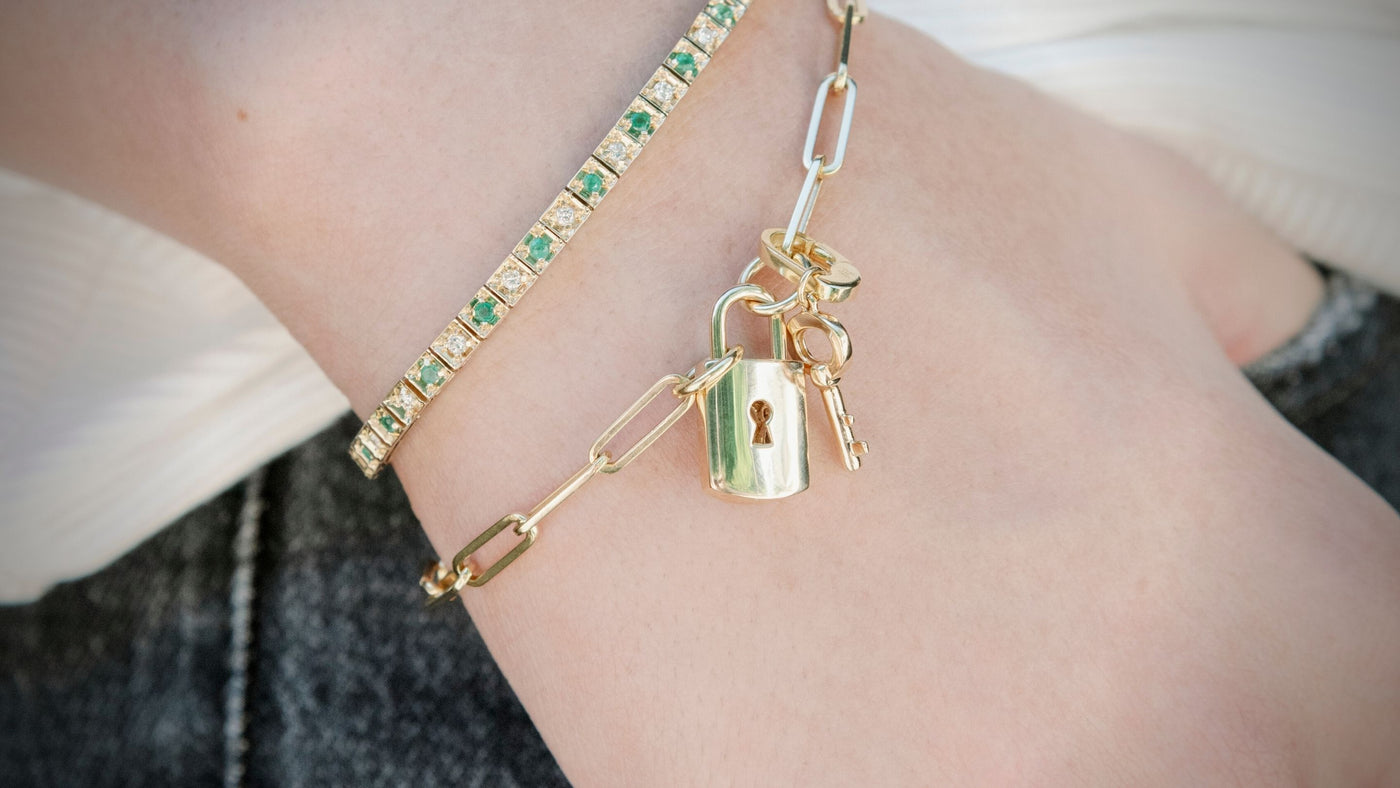 padlock and key charms on a bracelet