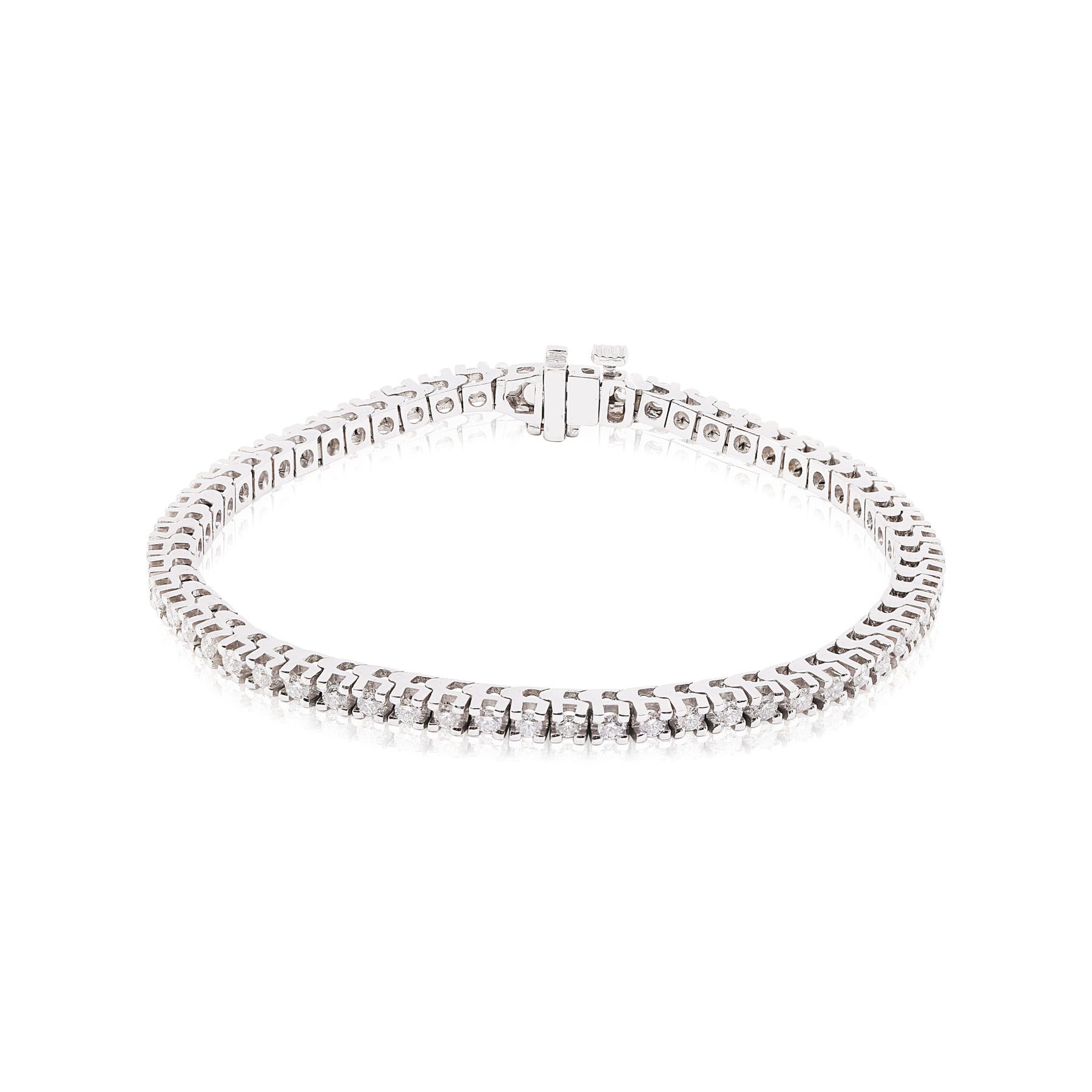 14K white gold 7-inch prong set diamond tennis bracelet set with 60 round brilliant cut diamonds