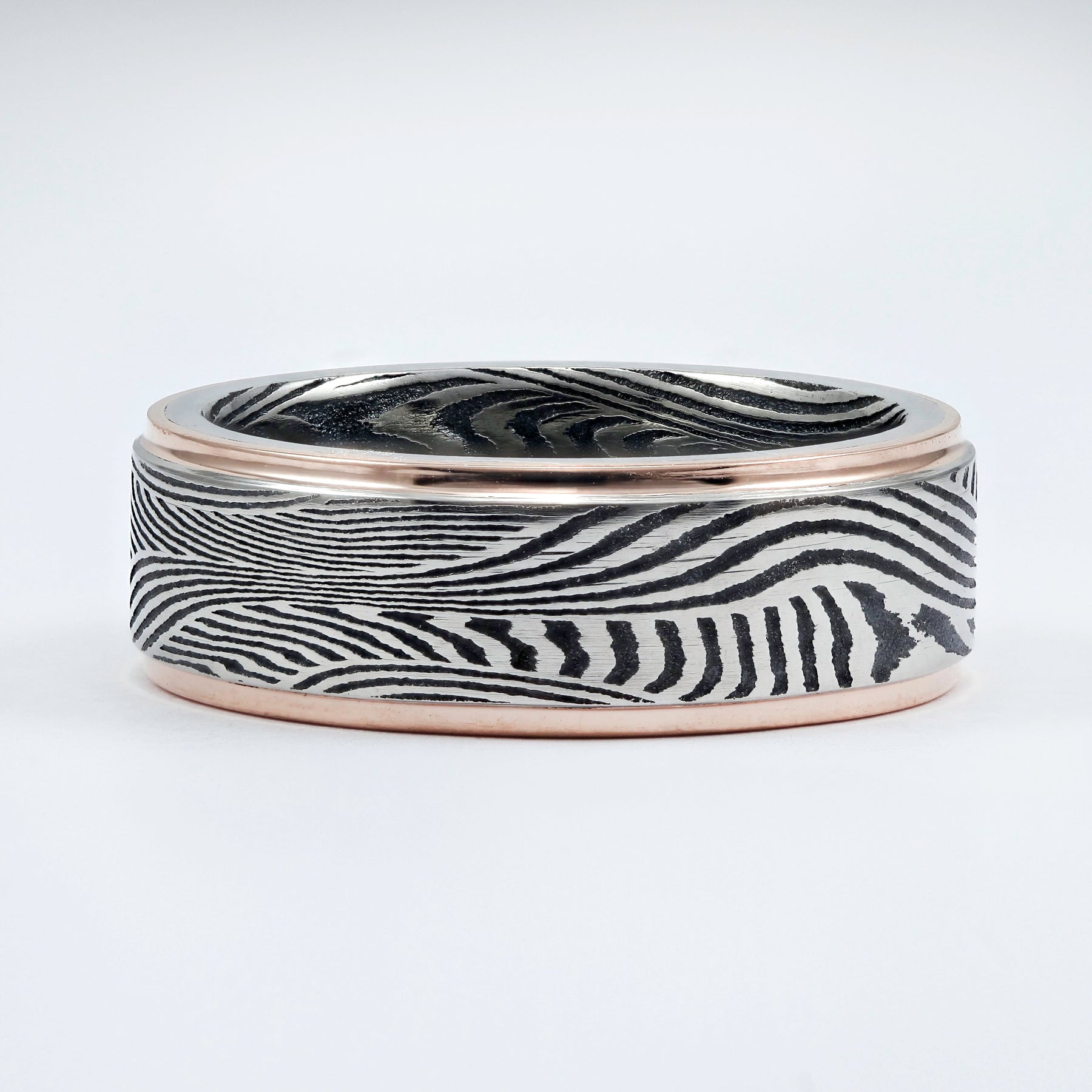 ACID FINISH SUNSET DAMASCUS STEEL WEDDING BAND WITH 14K ROSE GOLD EDGES