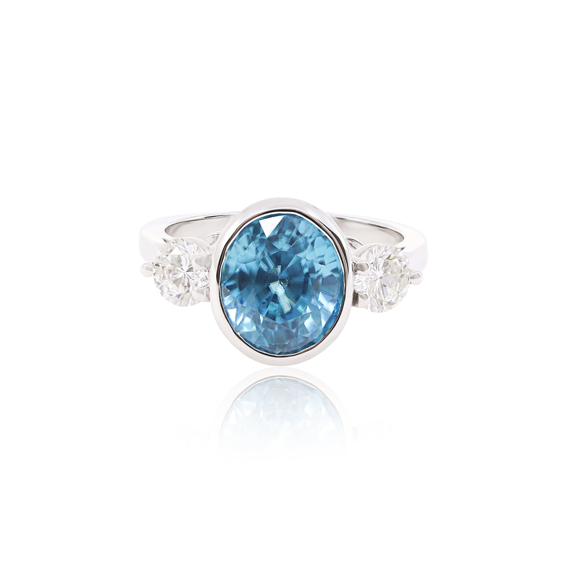 14K WHITE GOLD GREENISH-BLUE ZIRCON AND ROUND BRILLIANT DIAMOND THREE-STONE RING