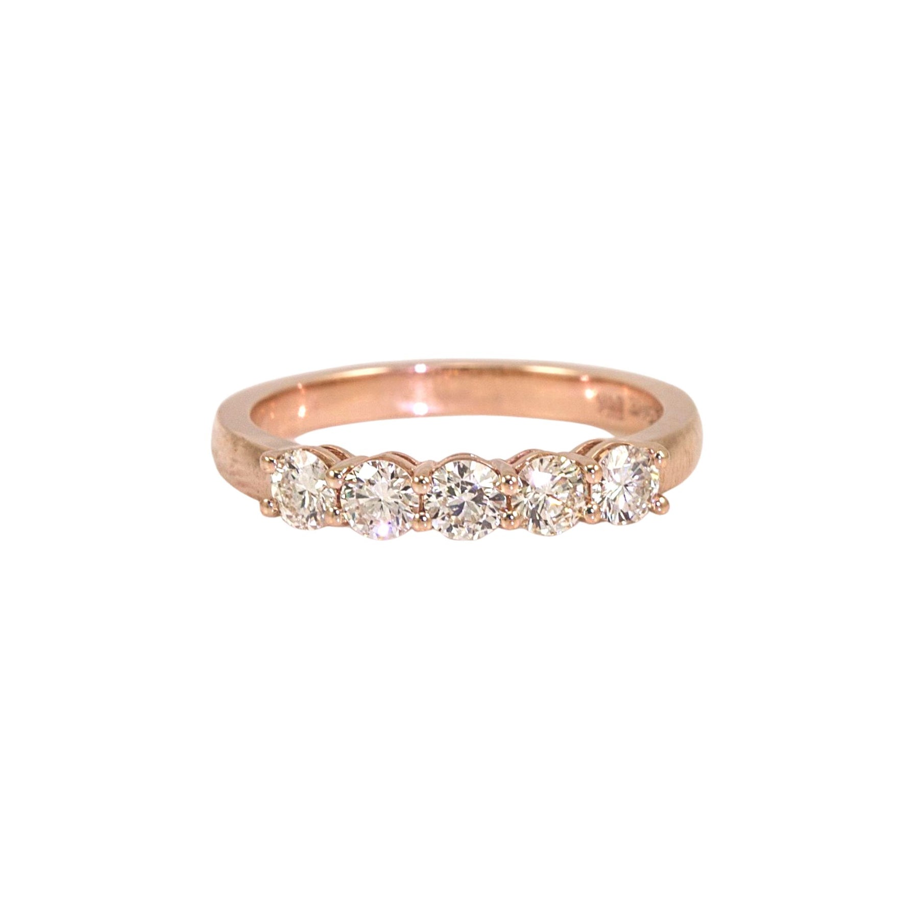 14 Karat rose gold shared prong band with 5 round brilliant diamonds weighing a total of .68 carats